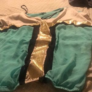 A teal black and gold blouse